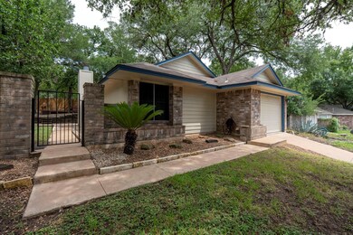 Ranch-style home with a gate, an attached garage,
