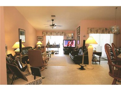Living Room. TILE THROUGHOUT INCLUDING THE THREE B