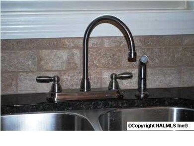 Goose-neck faucet makes for easy pot filling.