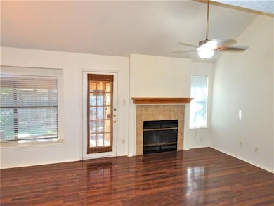 Unfurnished living room with wood finished floors