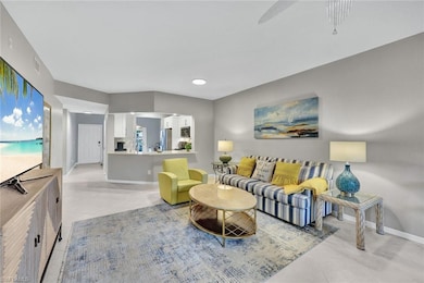 Tiled living room featuring ceiling fan