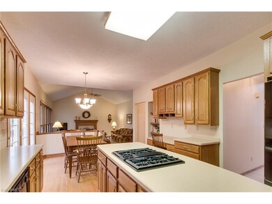 Beautiful kitchen has tons of wood cabinetry, cent