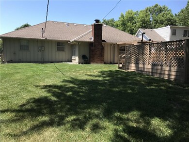 Generous fenced and shady back yard with deck and 