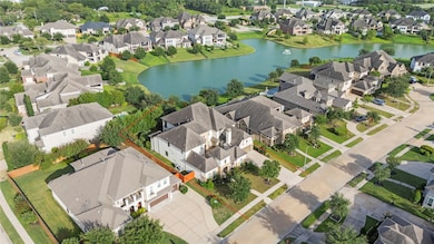 This great aerial view highlights the amazing location of this prime lot backing to the lake.