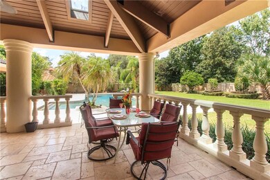 Travertine floors and wood beam ceilings with skyl