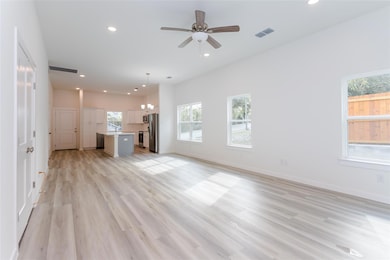 Unfurnished living room with light hardwood / wood