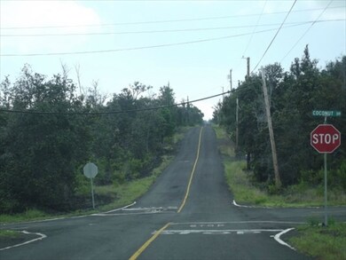property on the right with HELCO poles going up the road