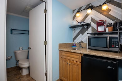 Bathroom featuring toilet, tile patterned flooring