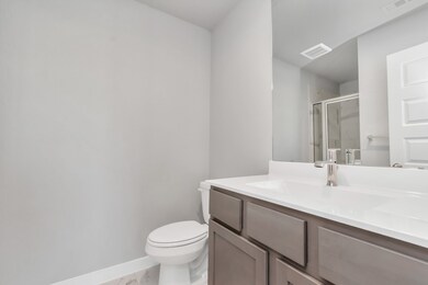 Guest suite bathroom, where tile flooring compleme
