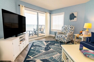 Living area with wood finished floors and baseboards