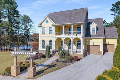 View of front of house featuring covered porch, roof with shingles, concrete driveway, and a front lawn