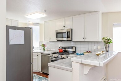 Appliances include stainless refrigerator, dishwas