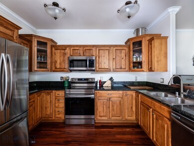 Kitchen with granite tile counters