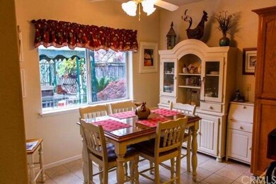 Informal dining area off Kitchen, with door to Pat