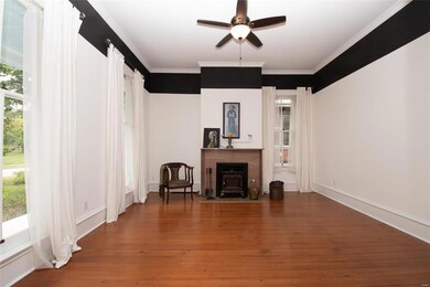 Living room with tall bright windows