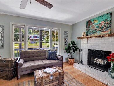 The living room features a ceiling  fan and firepl