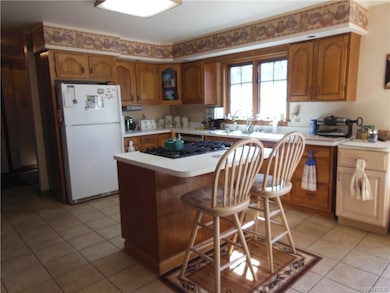 Country kitchen featuring ceramic tile flooring, J