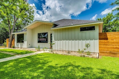 View of front of property with roof with shingles