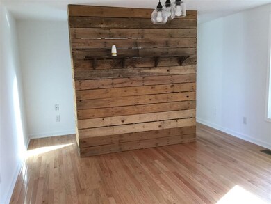 Slat wall doubles as Headboard with closet behind 