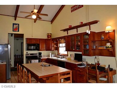 Kitchen - Cherry cabinets with glass doors. Tile c
