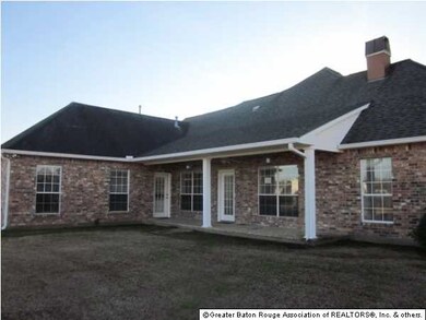 Back of home with porch