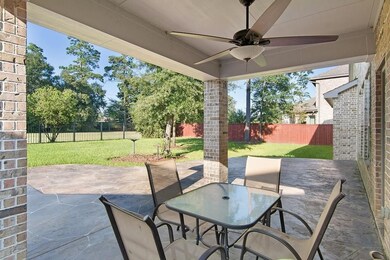 Covered, oversized back patio area provides a perf