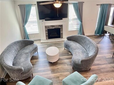 Open Family room with stone FP & surround sound