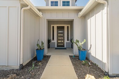 Property entrance featuring board and batten sidi