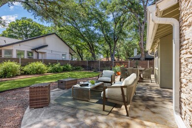 Fenced backyard featuring outdoor dining space, a
