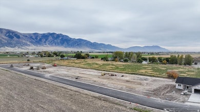 View of mountain backdrop featuring rural landscape
