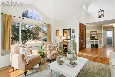 Living area with an inviting chandelier, baseboard