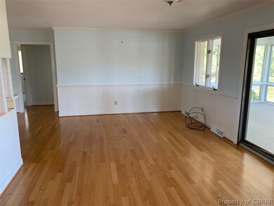 Living room area with wood floors.