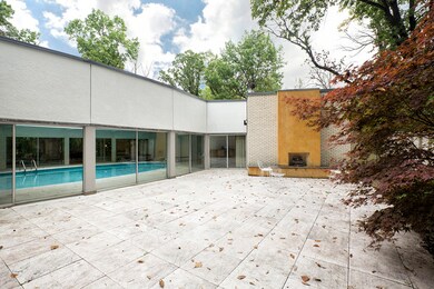 Sliding glass doors allow indoor-outdoor living.