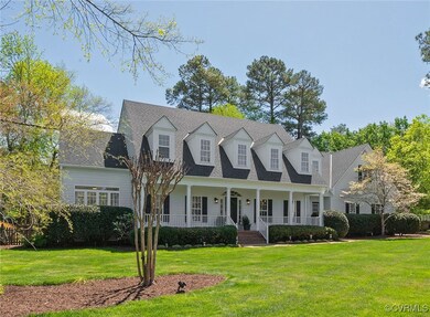 Cape cod house featuring roof with shingles, cover