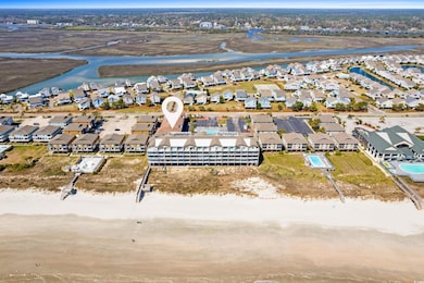 Birds eye view of property with a water view and a