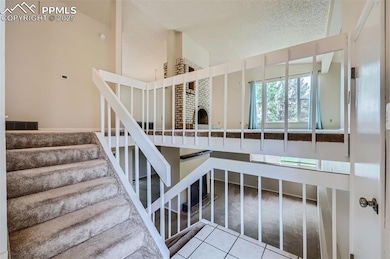 Entry Staircase with living room (up) and family r