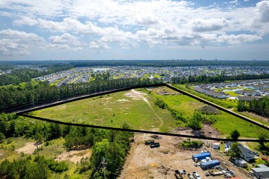 Aerial view of residential area featuring property parcel outlined