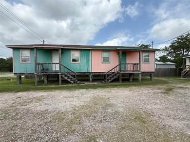 View of front facade featuring stairs