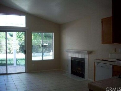 Family Kitchen with Fireplace, backyard access.