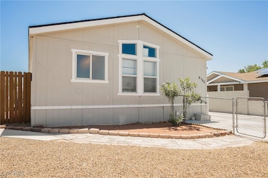 View of side of property featuring a gate