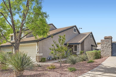 View of front of property with stucco siding, ston