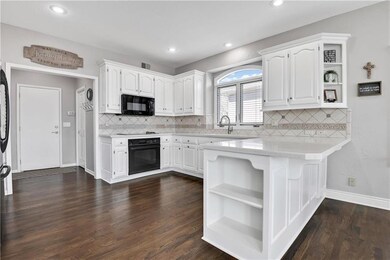 Clean and crisp enameled cabinets with tons of cou