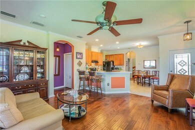 Living room facing the kitchen and breakfast bar. 