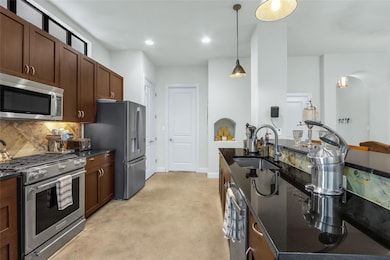 Kitchen featuring appliances with stainless steel