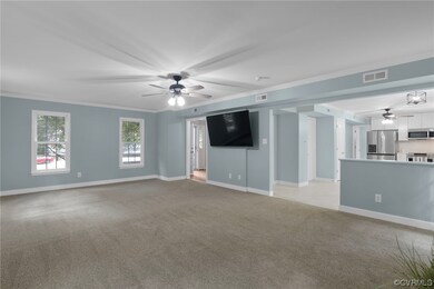 Spacious great room open to kitchen with wood burn