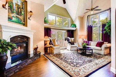 Spacious living room with gleaming hardwood floor,