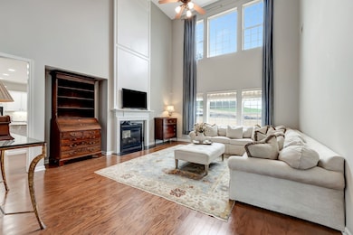 So much natural light pours into this 2-story Great Room! This living area is one of 3 common family living areas in this spacious residence!