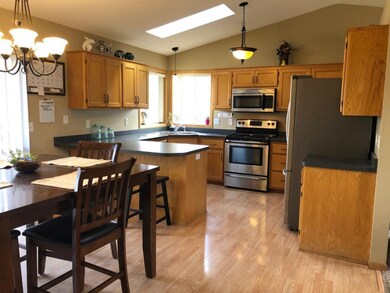 Kitchen has ample storage and new appliances that 