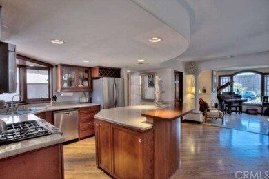 Remodeled open-concept kitchen with custom cabinet