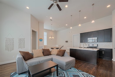 High ceilings flow into the open living area.